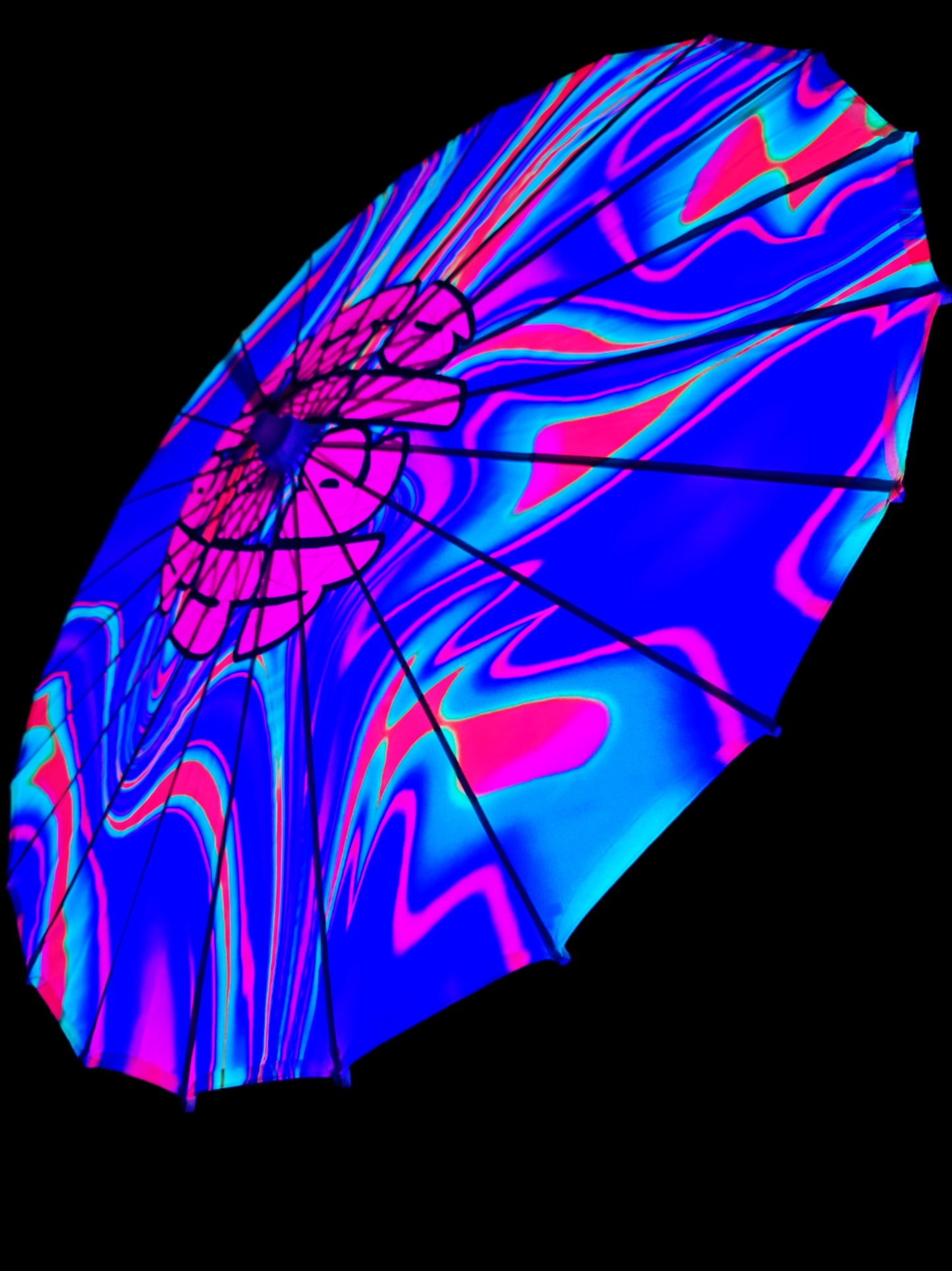 Colorful sun parasol umbrella with a vibrant, abstract design on a black background