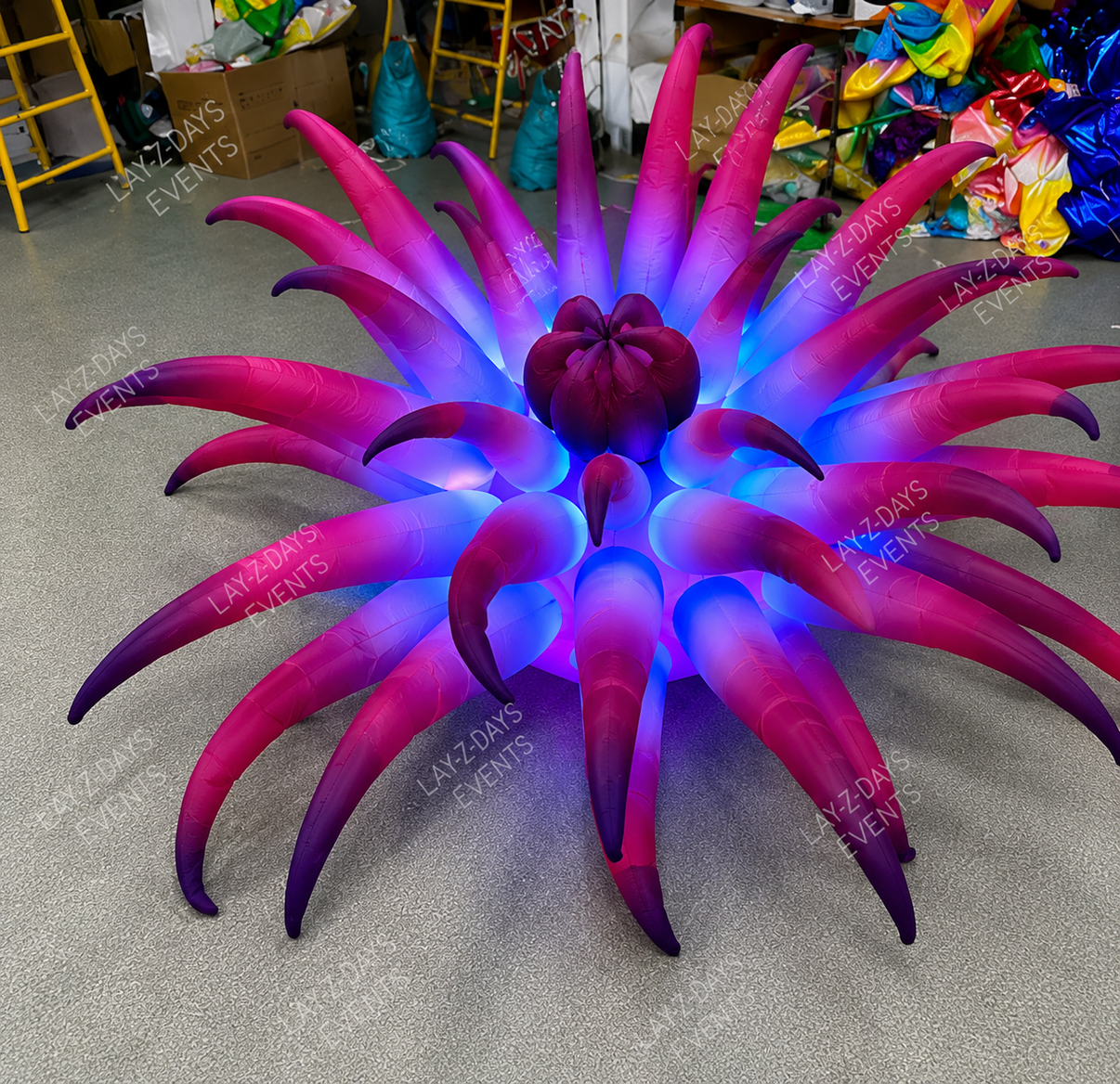 Large LED inflatable fantasy forest flower decoration by Lay-z-days Event's™, glowing with colorful lights in a lush garden scene.