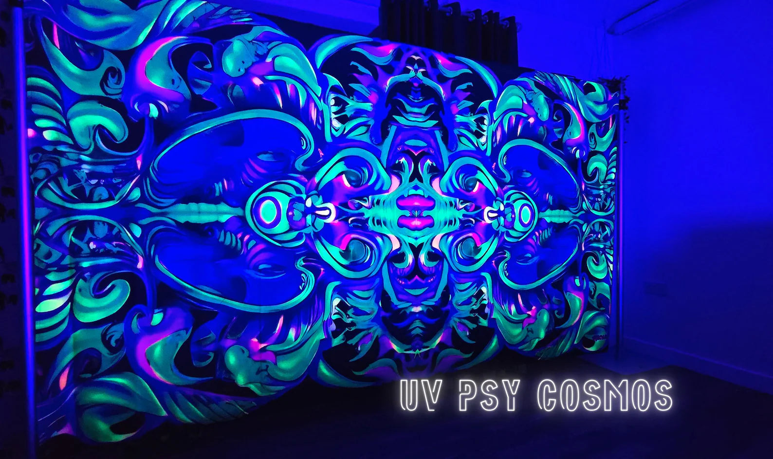 Giant UV reactive cotton velvet tapestry featuring psychedelic cosmic artwork that glows vividly under UV and blacklight.