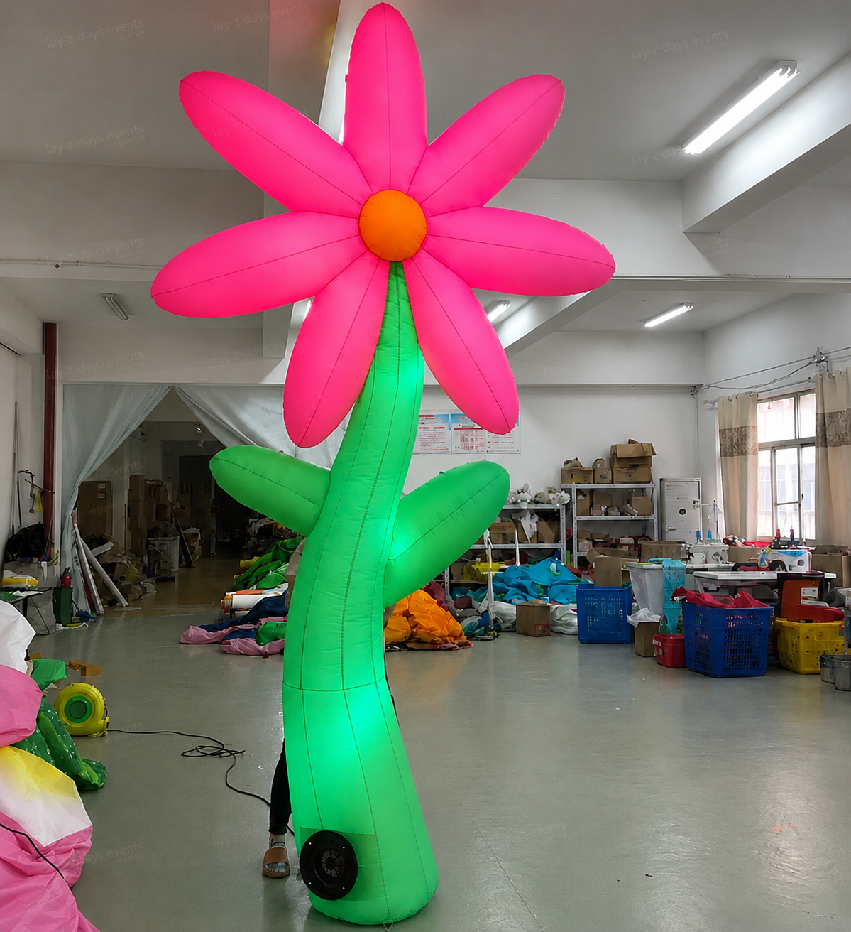 Large LED inflatable flower decoration by Lay-z-days Event's™, glowing brightly for event decor and outdoor celebrations.