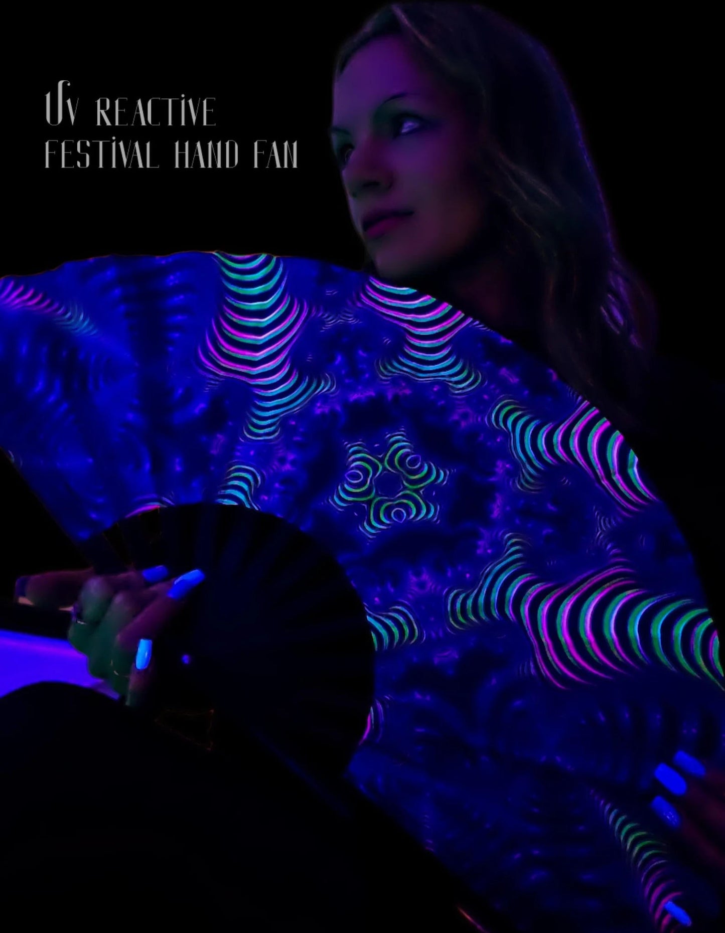 Person holding a glowing UV reactive festival hand fan with text overlay on a dark background