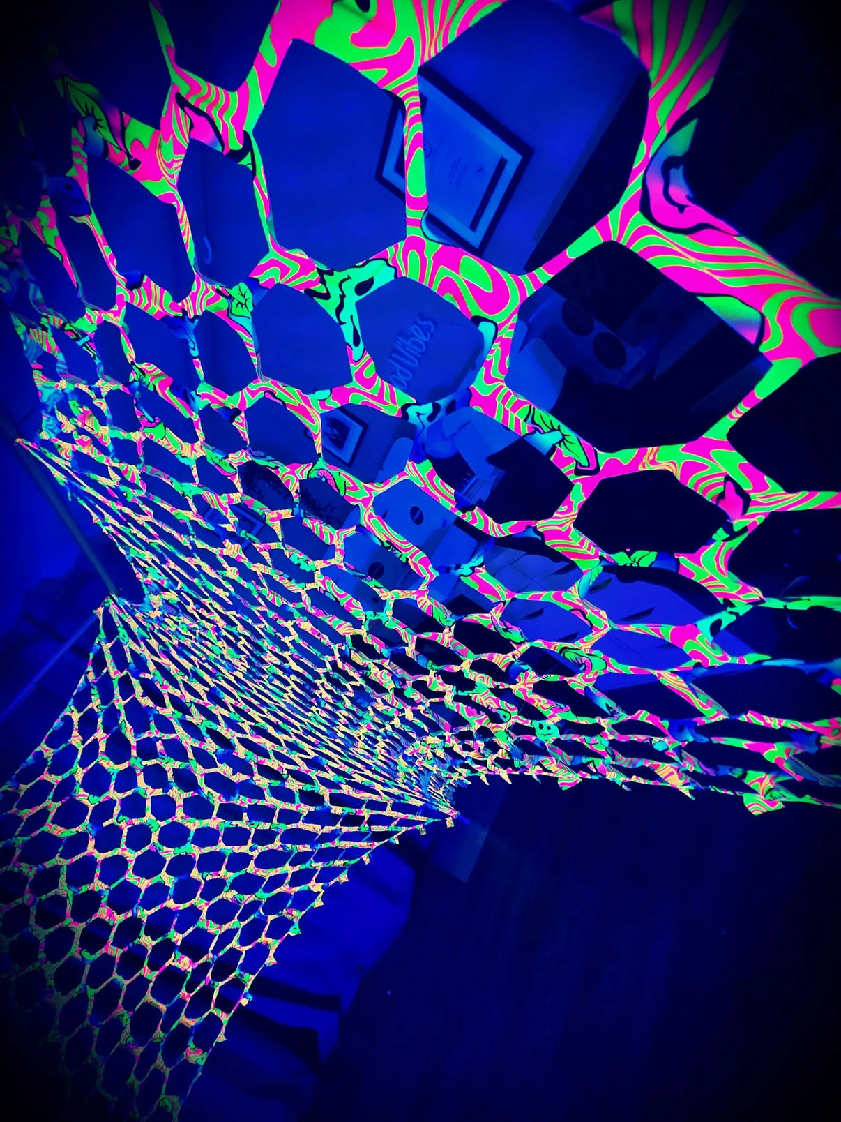 Lay-z-days Event's UV Happy face camo netting showcasing a vibrant, UV-protective camo net with bright happy face patterns