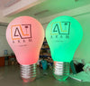Large inflatable LED lightbulb with custom branding, used as event decor by Lay-z-days Event's™.