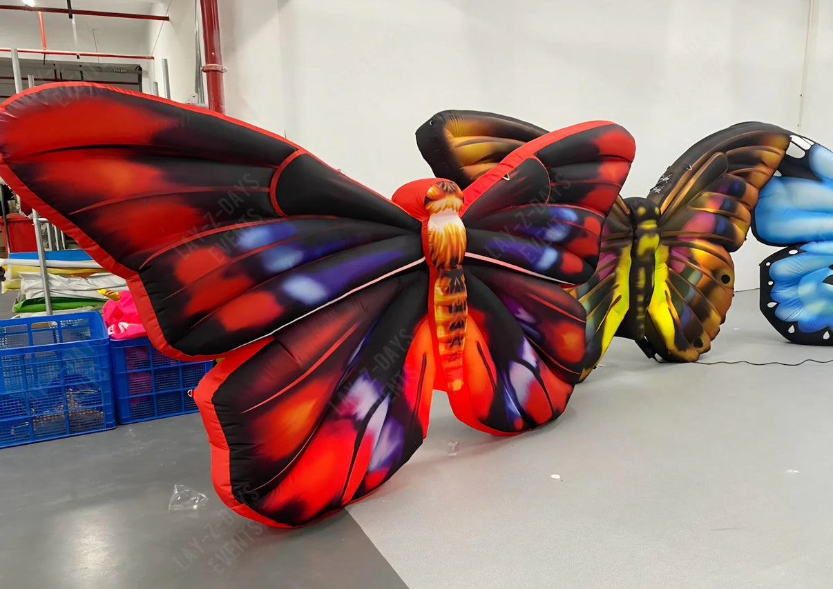 Lay-z-days Event's inflatable giant butterfly decor, colorful LED-lit butterfly for event decoration, inflated and vibrant.