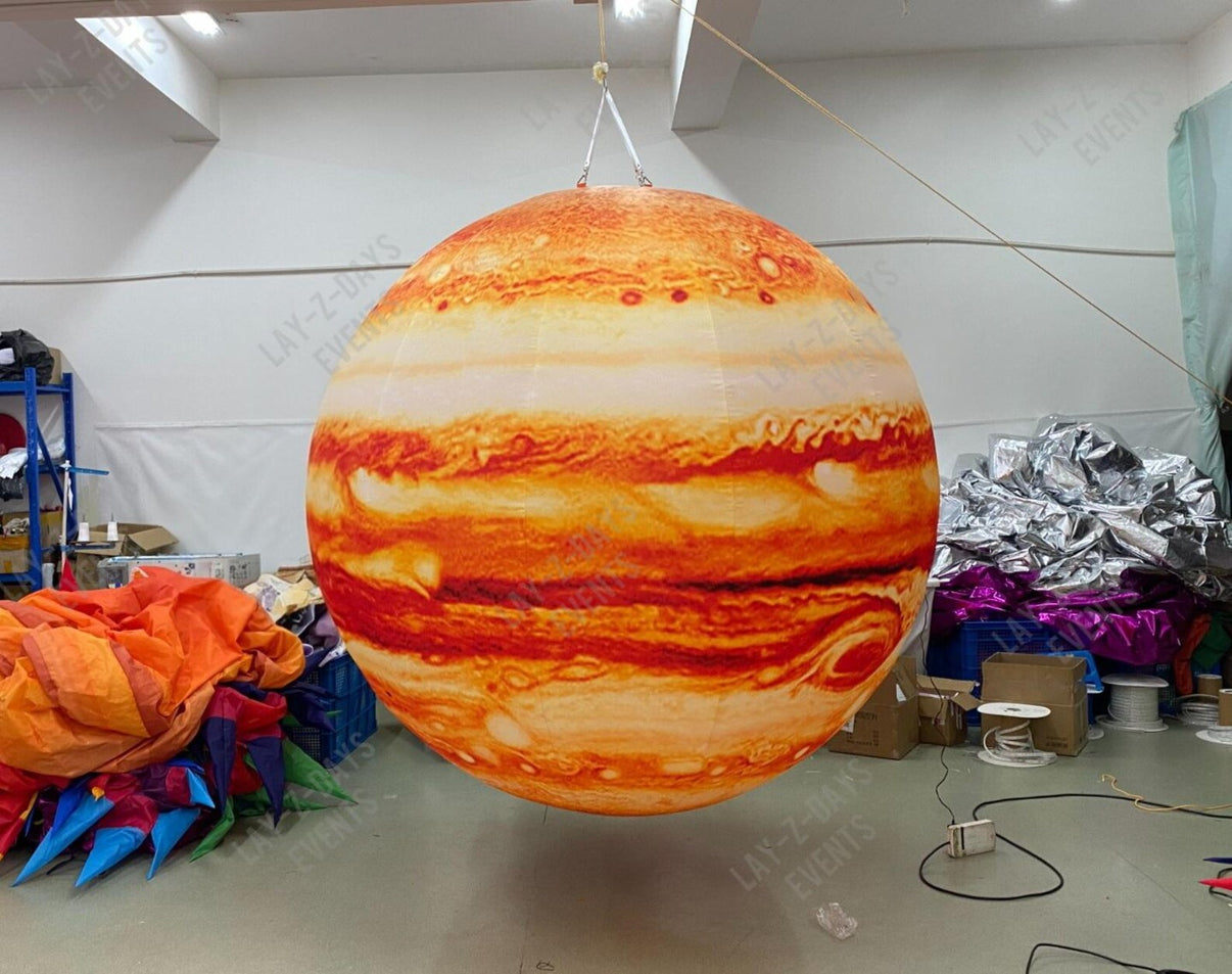 LED inflatable space-themed Jupiter decoration by Lay-z-days Event's™, designed for events, showing a large illuminated inflatable Jupiter planet.
