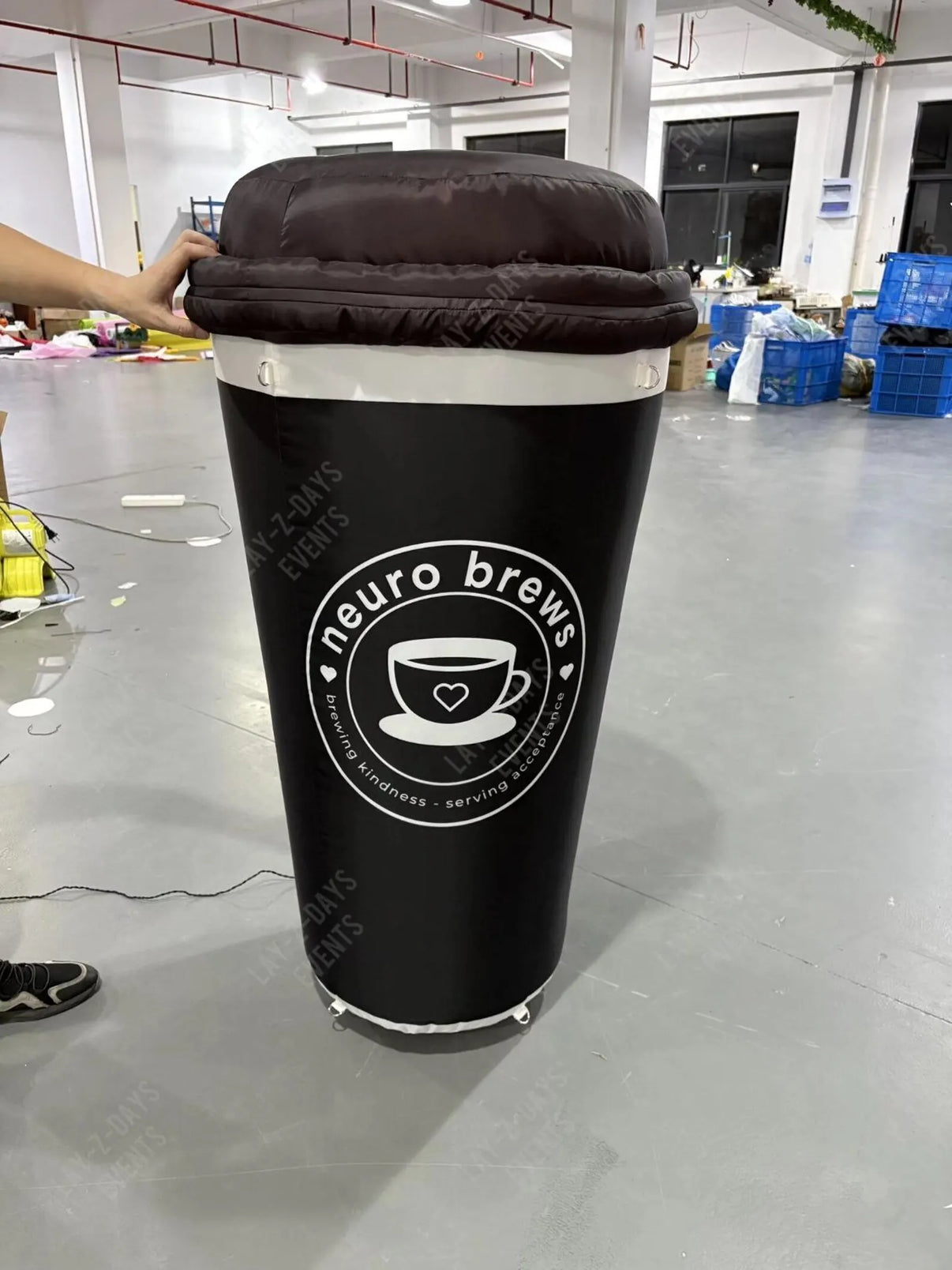 Bright LED inflatable coffee cup sign by Lay-z-days Event's™, used as branded cafe decor for an eye-catching display.