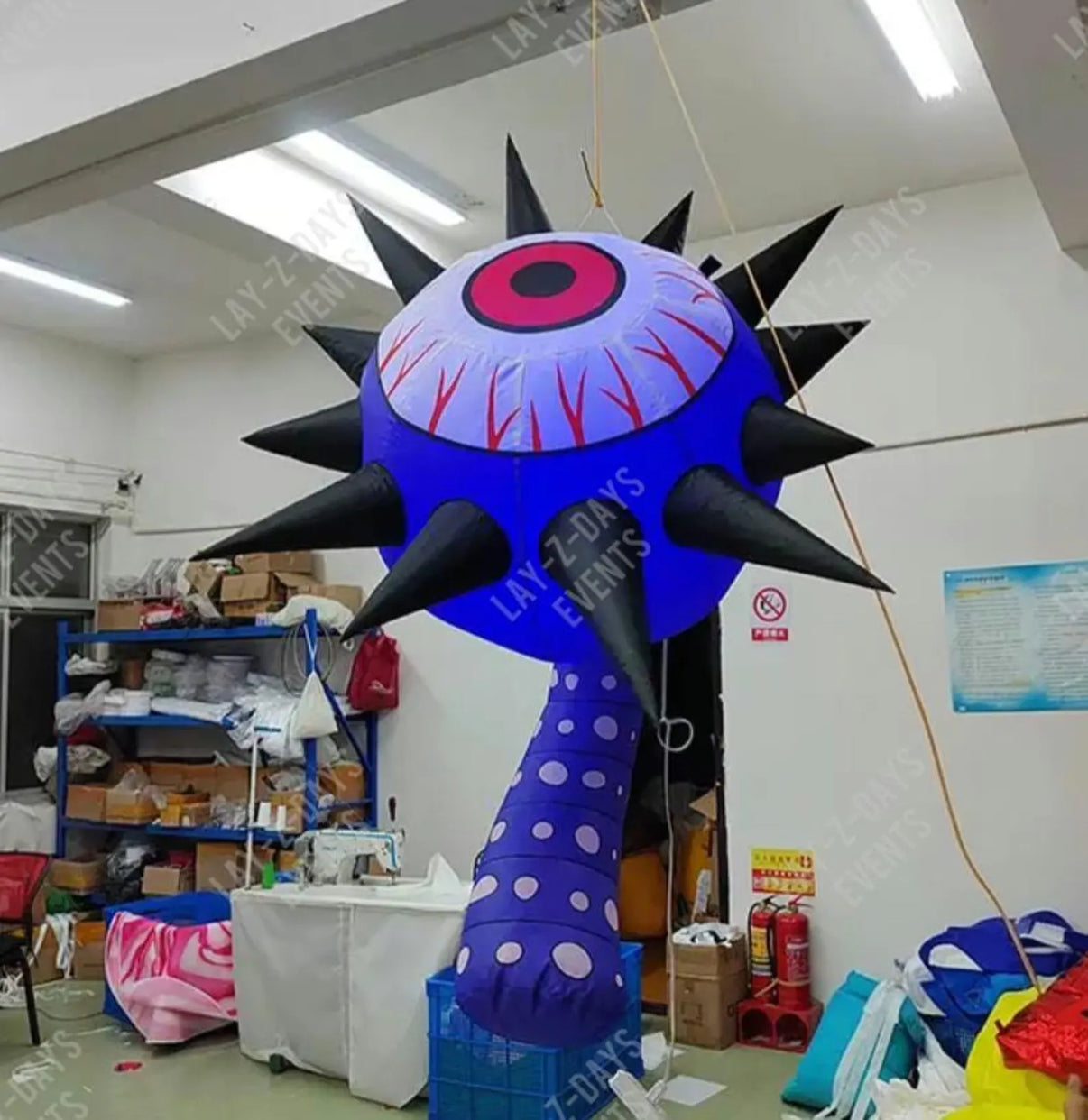 Lay-z-days Event's™ 1.5m LED inflatable giant spiked eyeball decoration with bright, colorful LED lights for spooky events and parties.