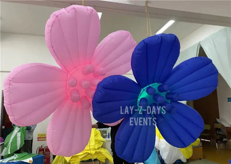 Pink and blue LED inflatable flower decoration by Lay-z-days Event's™, illuminated and inflated for event decor.
