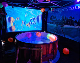 5-7 person hottub hire in a tent with cinema screen hire hottub cinema